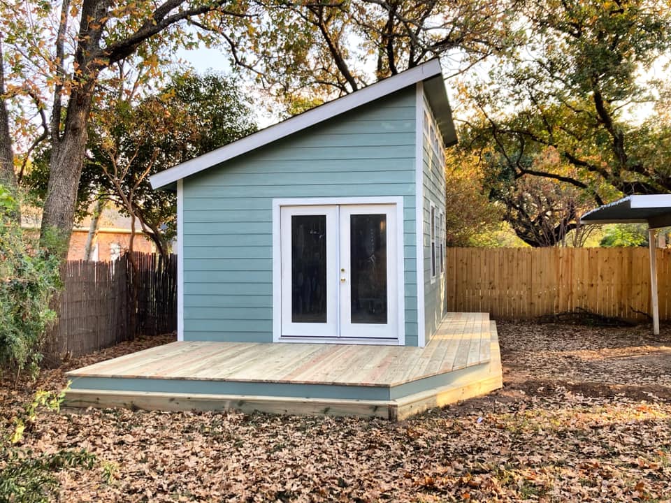 Blue single slope backyard studio shed.