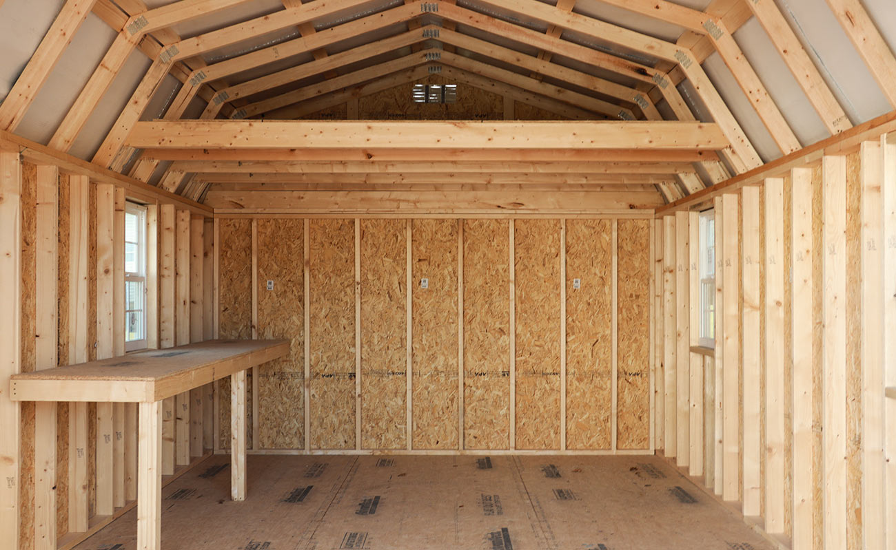 Lofted shed with work bench by Marten Buildings.