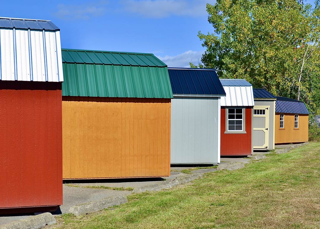 Multiple storage sheds for sale on lot