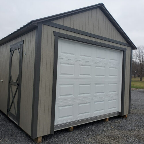 Tan garage shed with black trim from Ozark Portable Buildings