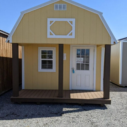 Yellow lofted barn cabin with white trim from ez portable buildings